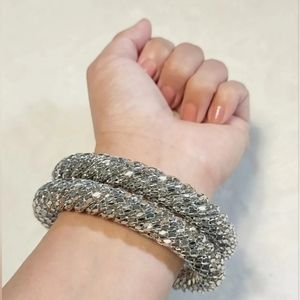 2 Large Silver Tone Cuff Bracelets with a Beautiful Rotating Sparkling pattern.